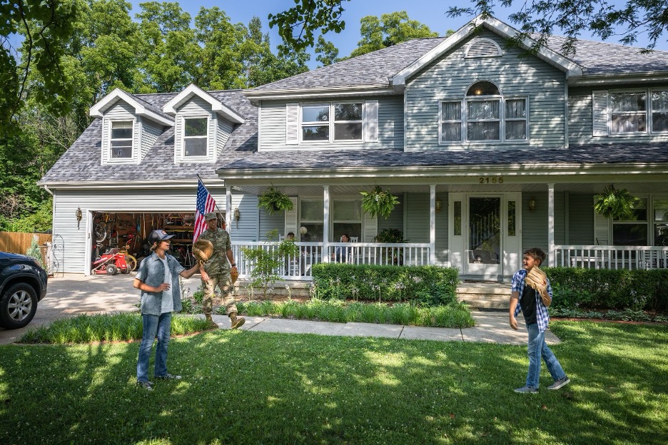 A military family playing catch.